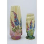 A pair of Royal Winton vases painted with foxgloves on a lemon yellow background, one with ribbed