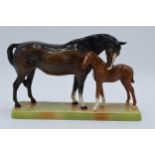 Beswick brown mare and chestnut foal on ceramic base 1811 In good condition with no obvious damage