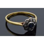 18ct gold and platinum daisy ring set with sapphire and diamonds. 2.1 grams. Size R/S.