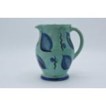 A Susie Cooper blue and green mottled glaze shouldered jug with stylised decoration, 16cm tall. In