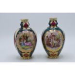 A pair of Royal Vienna (or similar) gilded baluster vases showing traditional scenes (2). 15cm tall.