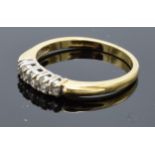 18ct gold ladies ring set with 5 diamonds. 2.8 grams. UK size O/P.