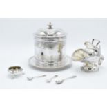 A collection of silver plated items to include a biscuit jar, sugar bowl and scoop, a salt and