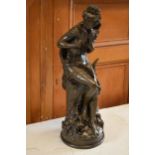 A large bronze-style resin figure of a seated lady wearing robes, 61cm tall with signature to