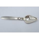 Georg Jensen: Sterling silver spoon of triangular form with full hallmarks to reverse. 15cm long.