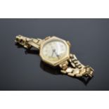 9ct gold cased Tudor ladies 17 rubies wristwatch on 9ct gold strap. 18.0 grams gross weight, 12.4
