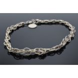 A sterling silver (marked 925) link chain with T bar, in the style of an Albert watch chain. 95.4