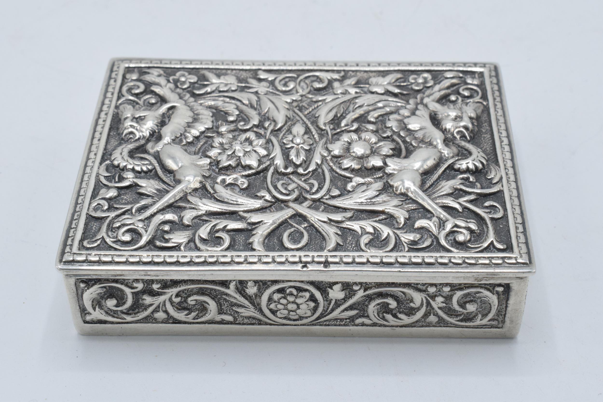 A continental silver ornate repousse antique box, 152.5 grams. 8.5 x 6.5cm.