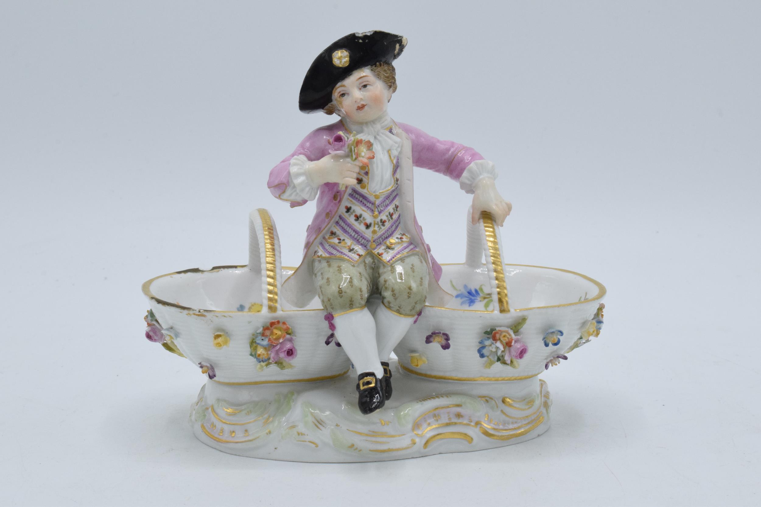 A late 19th / early 20th century Meissen figural table salt in the form of a young boy in 18th