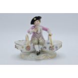 A late 19th / early 20th century Meissen figural table salt in the form of a young boy in 18th