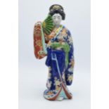 Japanese porcelain Geisha figure in blue floral Kimono holding fan, 31cm high. Early 20th century.