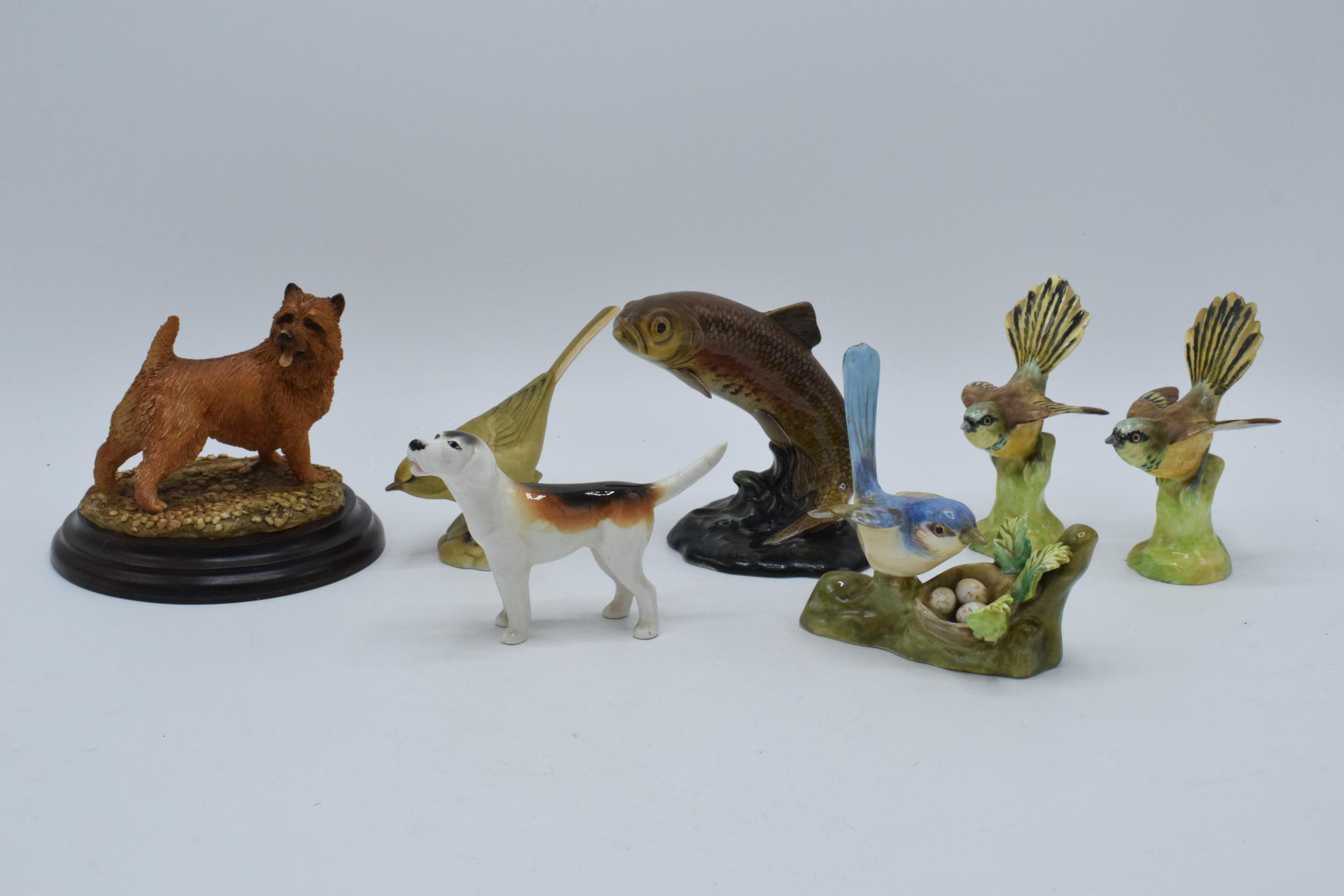 A collection of pottery animals to include Beswick fox hound, trout 1390 (af), Crown Staffordshire