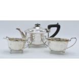 A silver 3-piece tea set to include a teapot with ebonised handle, sugar bowl and milk jug (3).