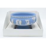 Wedgwood blue Jasperware pedestal bowl in original box. In good condition with no obvious damage
