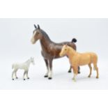 A trio of Beswick horses to include brown hackney horse 1361, a palomino facing left and a grey foal