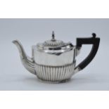 Silver teapot with ebonised handle, engraving to one side. Hallmarks slightly rubbed 1899, Chester