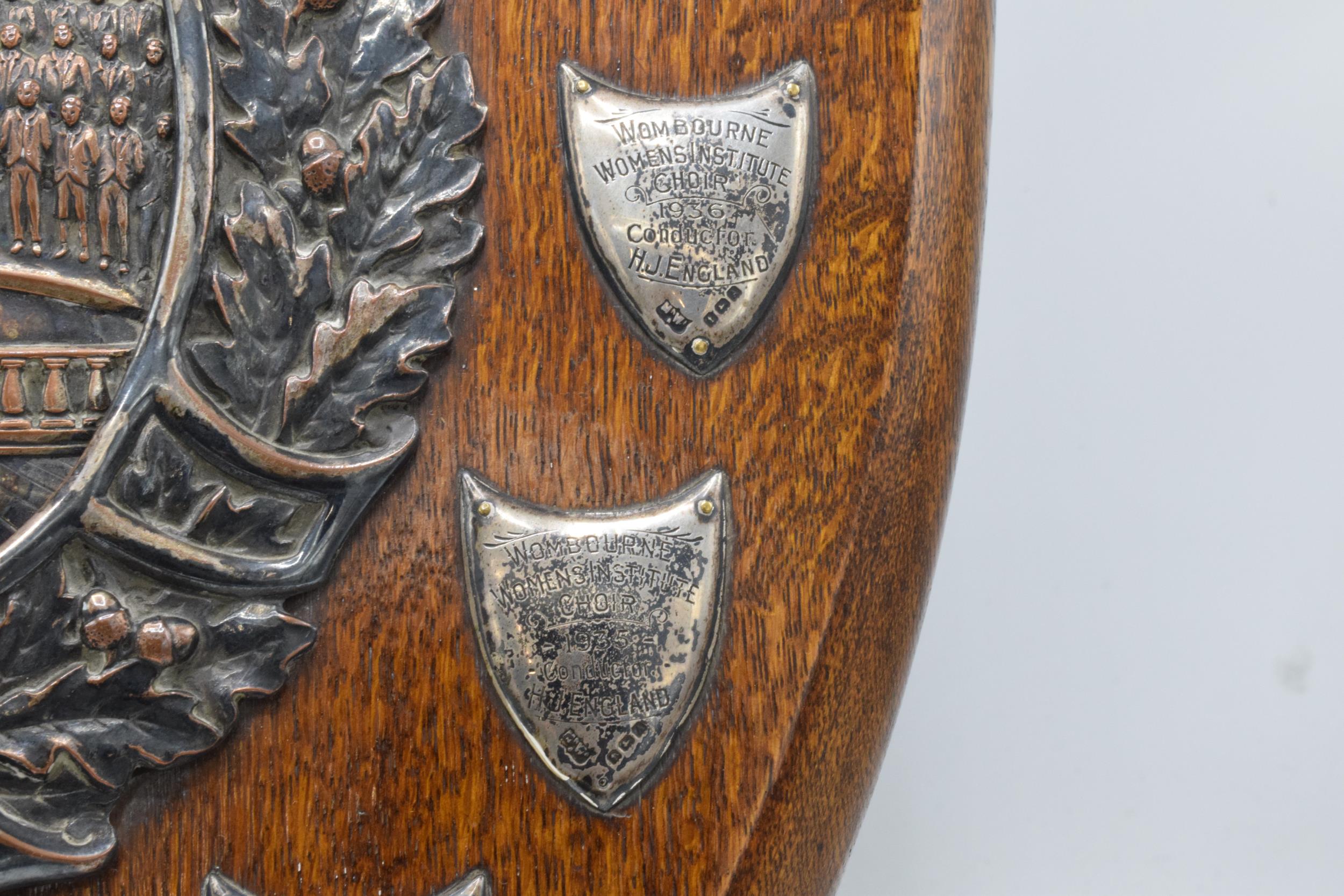 A wooden presentation shield with hallmarked silver name shields and a silver plate central relief - Image 8 of 12