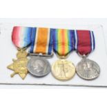 A set of 4 miniature World War One medals.
