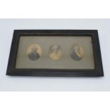 A late 18th / early 19th century framed trio of antique miniature charcoal portraits of three people