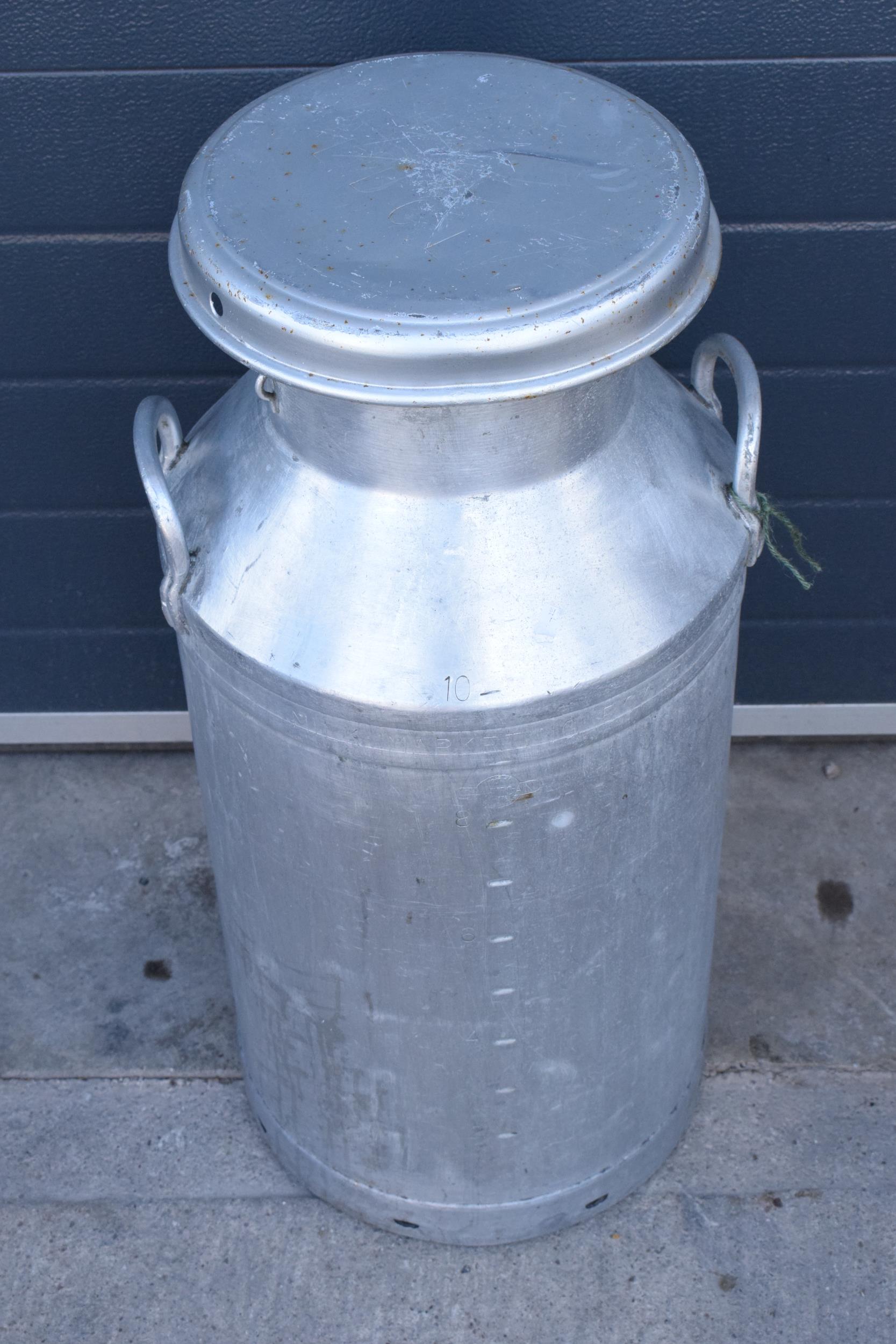 A vintage aluminium milk churn made by Swiftcan for the Milk Marketing Board, 75cm tall.