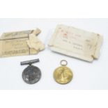 A pair of World War One medals to include Victory medal and silver 1914-1918 medal with documents (