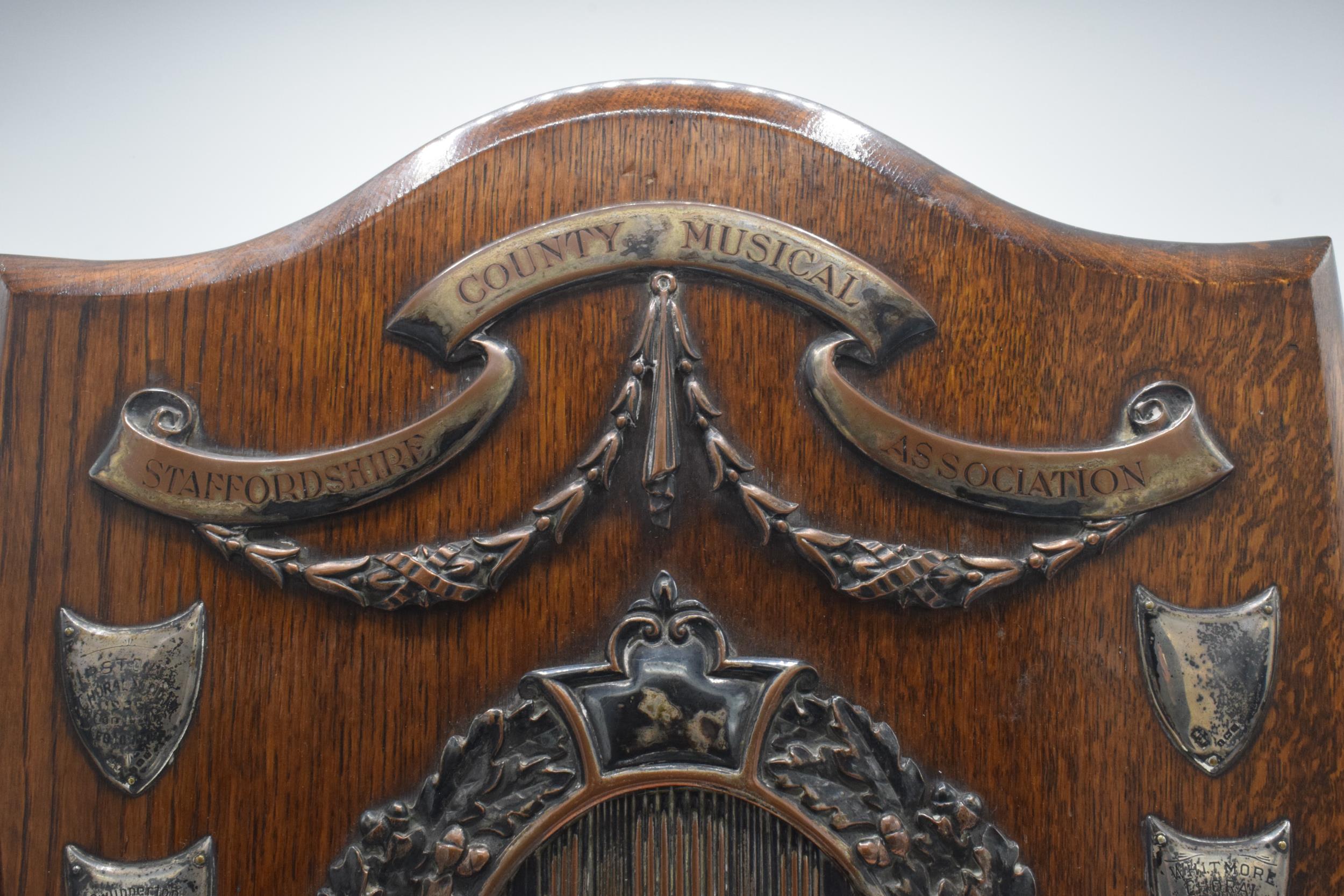 A wooden presentation shield with hallmarked silver name shields and a silver plate central relief - Image 11 of 12