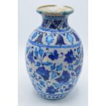 A 19th century blue and white pottery Iznik or similar vase with crackle glaze effect. 25cm tall. In