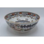 A late 18th / early 19th century English pottery bowl depicting oriental scenes, 29.5cm diameter,