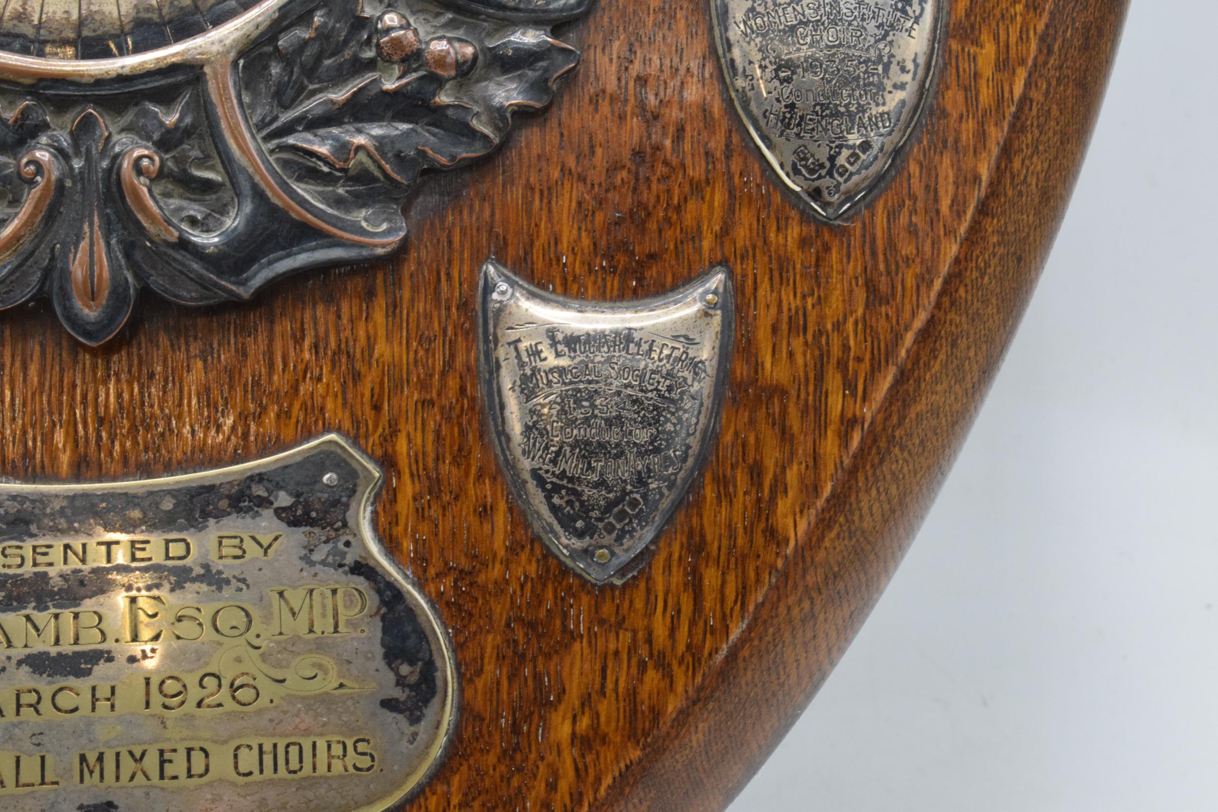A wooden presentation shield with hallmarked silver name shields and a silver plate central relief - Image 9 of 12