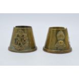 A pair of 20th century trench art brass spill vases with RAF badge and one similar, 5.5cm tall.