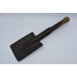 An early to mid 20th century wooden and metal trench spade / shovel, 45cm long. Old woodworm to