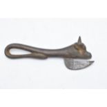 An early to mid 20th century Army Bully Beef cast iron tin opener in the form of a bull