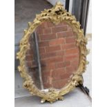 A mid 20th century gilt-style plaster mirror, 67cm tall. In good functional condition with some