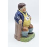 A Staffordshire-style pottery figure of Daniel Lambert in his chair, 24cm tall. In good condition