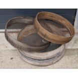 A trio of vintage wooden gardening sieves, largest 53cm diameter.