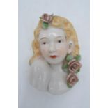 Mid 20th century pottery wall vase in the form of a lady with flowers, 18.5cm tall. In good