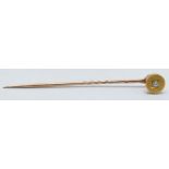 Gold and diamond chip stick pin, 6cm long.