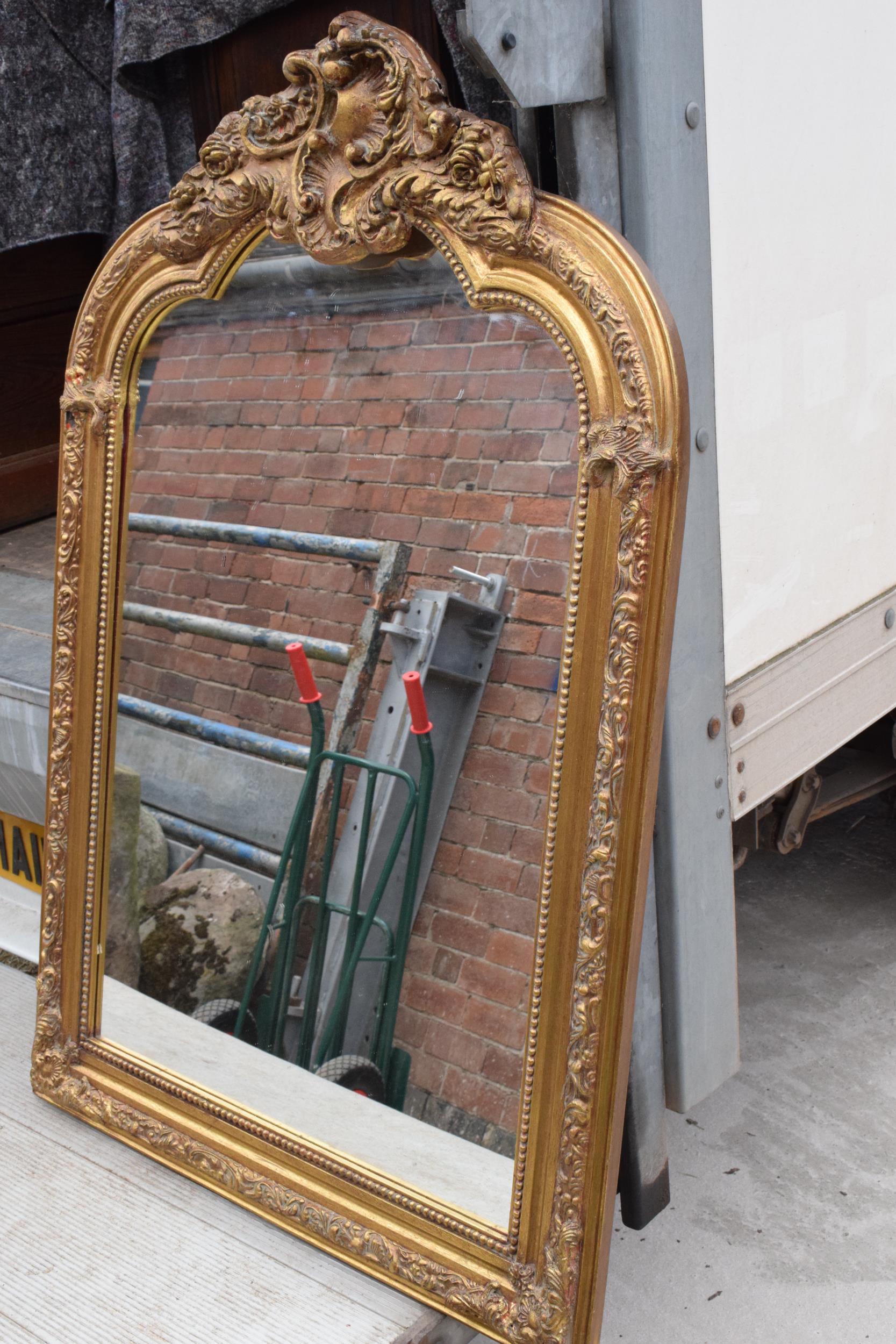 A large vintage gilt-style hanging over mantle mirror, 118cm tall. In good functional condition with - Image 5 of 7