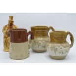 A collection of late 19th century two-tone stoneware jugs with traditional scenes together with '