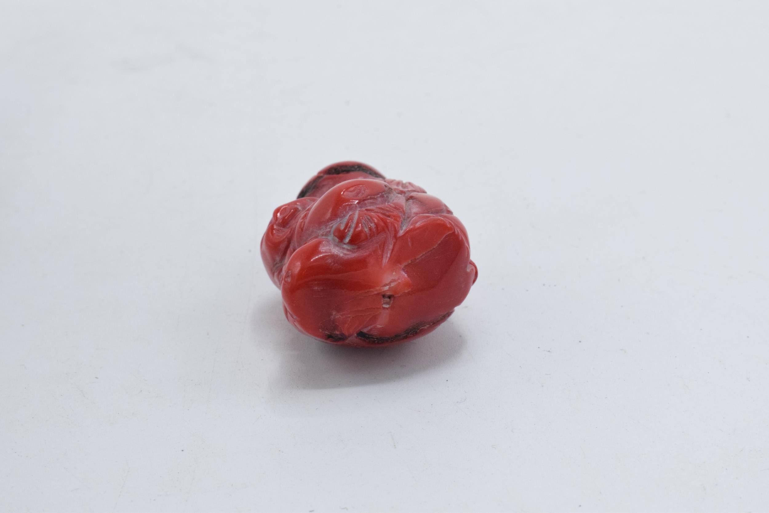 Red hard stone Netsuke type toggle with small pierced hole through top section, 4cm tall. - Image 3 of 3