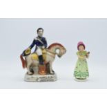 An early Goebel / Hummel figurine of a girl holding a portrait FB1 together with a Staffordshire