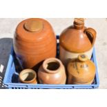 A collection of stoneware items to include a Buckleys of Lllanelly flagon, Doulton and Co large