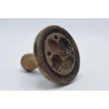 19th century wooden treen butter stamp with leaves pattern, 12cm tall.