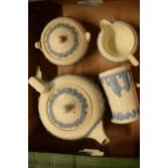 Wedgwood blue and white Queensware items to include a teapot, lidded sugar, milk jug and creamer (4)