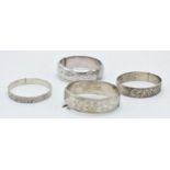 4 silver bangles of varying ages and forms (132.4 grams).
