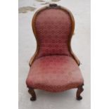 19th century / Edwardian upholstered nursing chair, 88cm tall, carved decoration to the top. In need