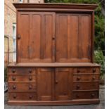 Large Victorian stained pine housekeepers cupboard with sliding doors to top half above a central