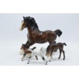 A collection of Beswick horses to include brown cantering shire, brown outstretched foal, grey