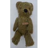 Pixie Toys jointed teddy bear with glass eyes, 21cm tall. In good condition with some wear to the