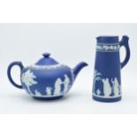 Wedgwood dark blue Jasperware teapot together with a tall jug with unusual handle (2). Generally